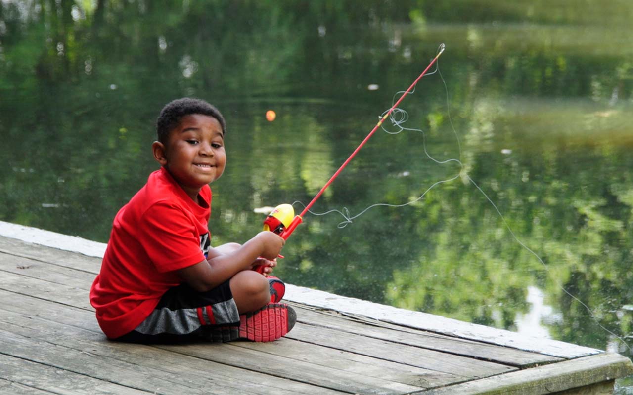 Camper fishing off the dock